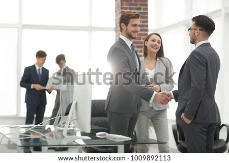 handshake business partners at a meeting Royalty-Free Stock Photo #1009892113