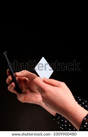credit card and phone in hand stock photo