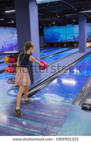 Defocused activity bowling child girl sport blur background selective focus.