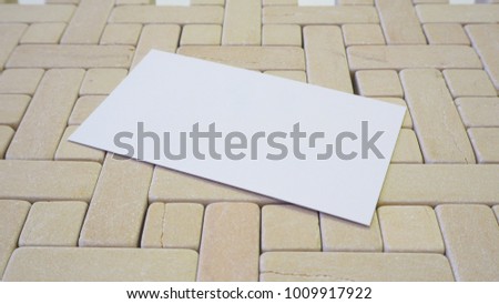Business card blank over gray textured stone.