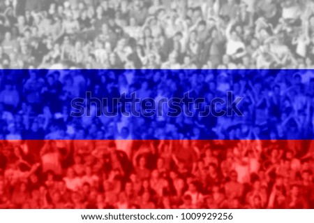 Crowd of football, soccer fans with raised arms with blending Russia flag