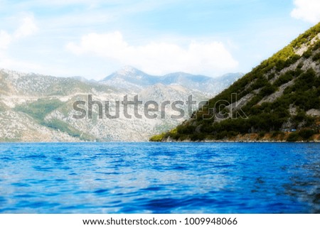 blue sea with mountain views