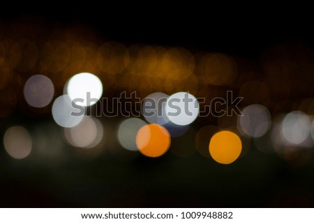 Multicolored abstract blurred city lights with bokeh effect