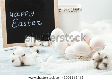 Easter white eggs on a light background Background for a postcard.