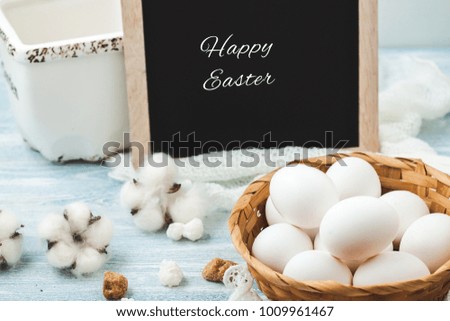 Easter white eggs in a wicker basket on a light background Background for a postcard.