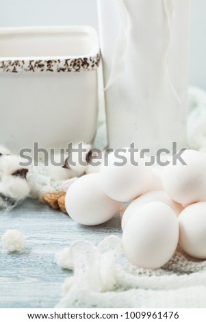 Easter white eggs on a light background Background for a postcard