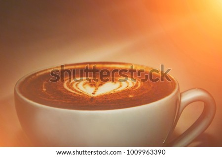 Cup of cappuccino coffee. Toned