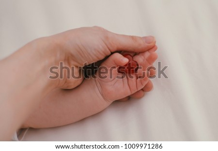 I love you Mom, Mother's Day celebration with parent woman holds young kid's hands supporting red heart, charity donation for nursing and parenting children adoption, family health care concept Royalty-Free Stock Photo #1009971286