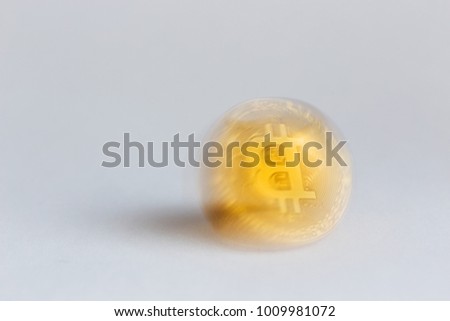 Bitcoin in motion with blurred contours on a white background