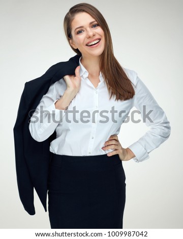 Portrait of smiling businesswoman holding black suit jacket on shoulder. Isolated on white.