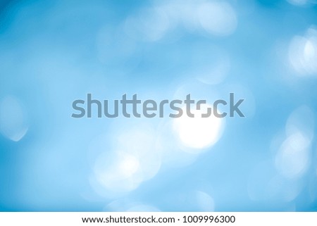 Abstract christmas bokeh lights On Blue Background.