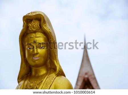 Golden statue portrait at Wat Phu Khao Thong temple in Ayutthaya. Thailand.
