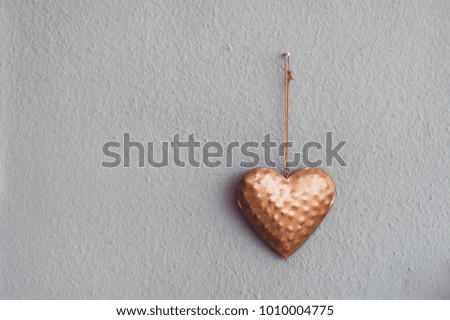 old wall decorated with golden heart. picture with place for your text