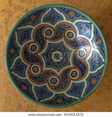 Brightly painted bowl with Moroccan pattern