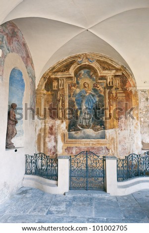 Fresco of Madonna with angels as an architectural detail of one of public palaces of Varese