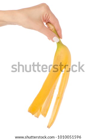 Peel of banana in hand on white background isolation