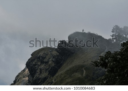 Man walking on the cliff