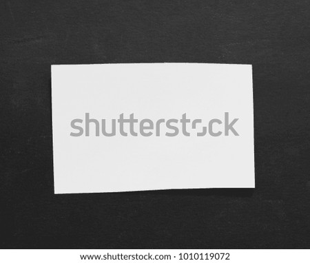 torn paper isolated on black paper background with copy space for text