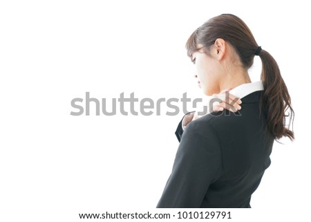 Businesspersons suffering from shoulder discomfort