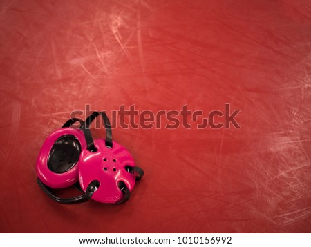 Wrestling gear on mat Royalty-Free Stock Photo #1010156992