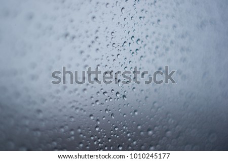 raindrops on the window glass, toned, close up