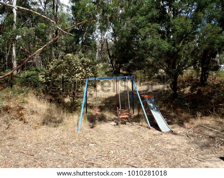 old playground on a bushland farm in the countryside