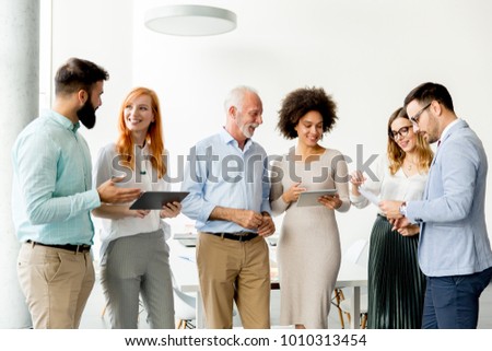 Portrait of multiracial business people standing in the office