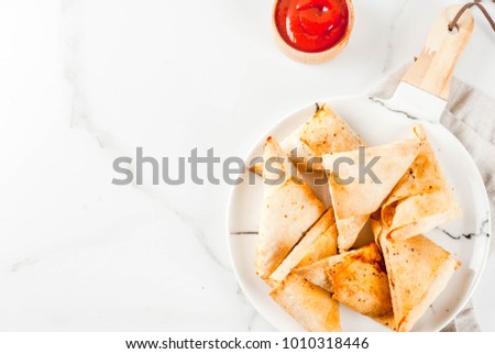 Asian food. Vegetarian samsa (samosas) with tomato sauce. white marble background copy space top view
