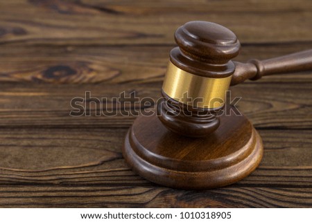 hammer of judge on a wooden table. close-up. law, crime and punishment, the court.
