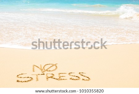 No stress concept written on the sand of an exotic beach Royalty-Free Stock Photo #1010355820