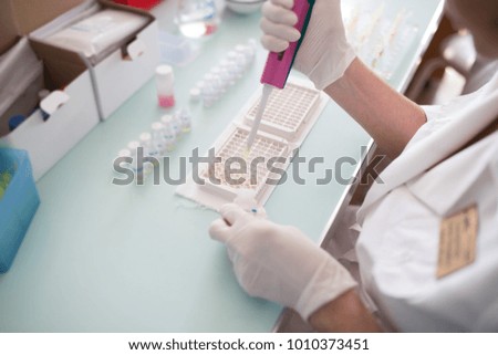 researcher doing research in a lab. Scientist doing chemical test in laboratory. Doctor doing medical analysis. Close up