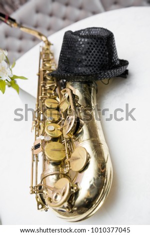saxophone lies, black hat