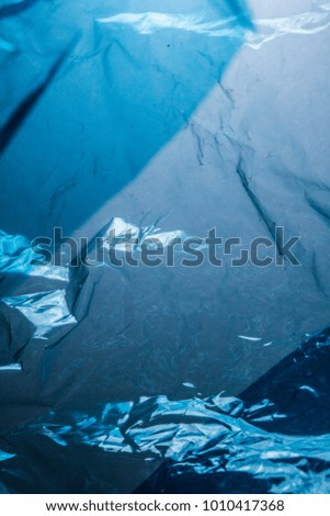 Plastic Shiny See Through Abstract Shimmer Creased Background Blue