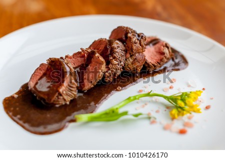fillet mignon in red wine sauce Royalty-Free Stock Photo #1010426170