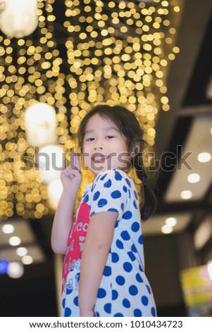 Asian little cute girl in the night park