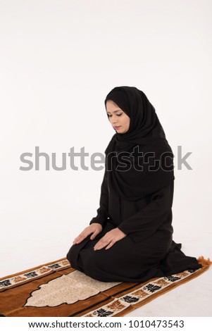 Muslim woman praying on white Background