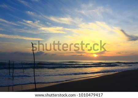 Sunrise on the beach by the sea.