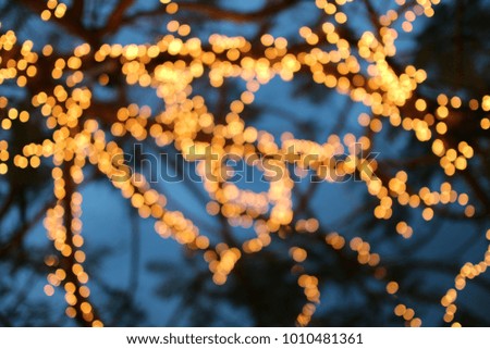 Bokeh lights in the city with light blurred background for graphic design and web.