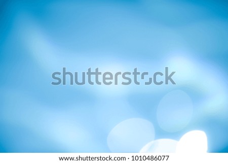 Abstract christmas bokeh lights On Blue Background.