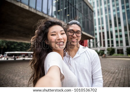 Asian Couple Taking a Selfie