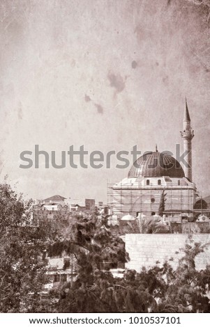 Restoration of Muslim mosque in the old city of Akko. Al-Jazzar mosque as fine example of the Ottoman architecture in old Acre, Israel. Vintage style toned picture