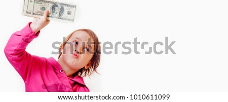 I am winner!  Little business girl girl is happy with the dollars money. Success, wealth management. (Humorous picture)