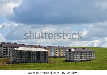 Construction buildings. New buildings in the background beautiful blue sky with clouds