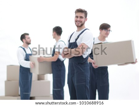Photo workers holding boxes when moving flats,