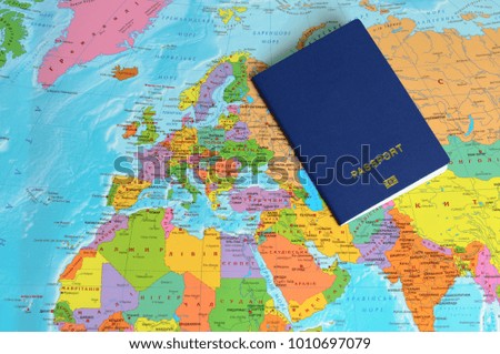 blue passport on the world map 