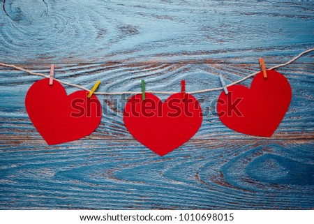 Valentines day background decorated with red hearts and postcard/copy space