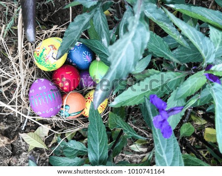 Colourful easter egg pictures with green leaves background