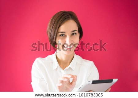 Young woman with a tablet PC