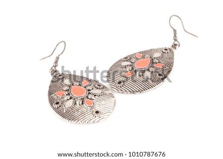 Ancient style earrings isolated on white background.
