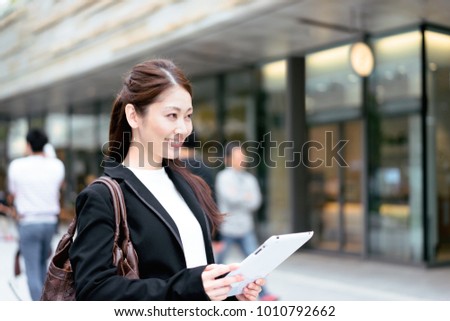 Young woman with a tablet PC (business image)